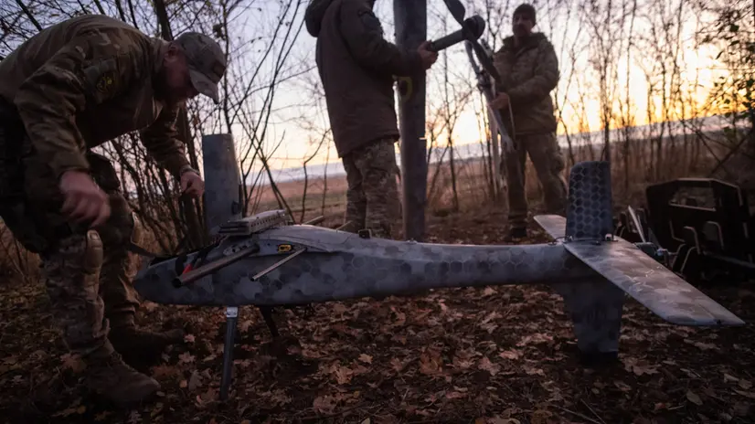 epa12501023 Pilots from the Predator Brigade's unmanned vehicle unit of the Ukrainian Patrol Police in Donetsk assemble a GARA bomber drone on a nighttime strike mission against Russian forces on the Pokrovsk front line, Ukraine, 02 November 2025 (issued 03 November 2025). Russian offensives have intensified in the area in recent weeks. EPA/MARIA SENOVILLA