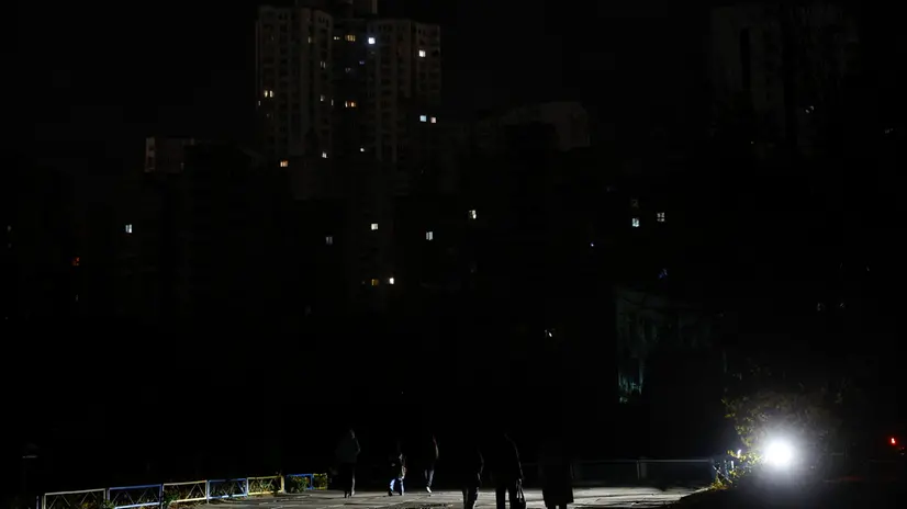 epa12516806 A darkened residential area is seen during a power outage in Kyiv, Ukraine, 10 November 2025 amid the ongoing Russian invasion. The main target of the Russian shelling of Ukraine on 08 November was the gas and electric infrastructure. Due to problems with the power supply, most Ukrainian regions are facing a hard electricity cut-off for more than ten to twelve hours per day. EPA/SERGEY DOLZHENKO 101104