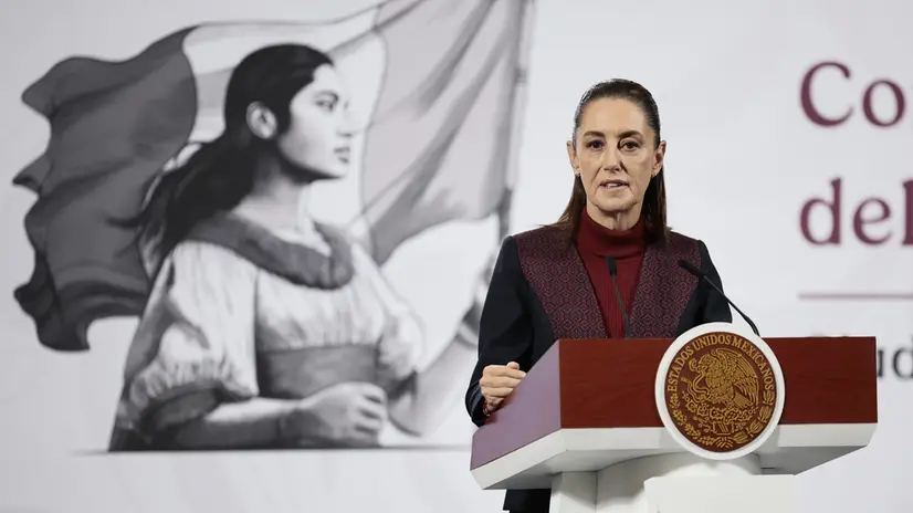 epa12518826 Mexican President Claudia Sheinbaum speaks during a press conference at the National Palace in Mexico City, Mexico, 11 November 2025. Homicides in Mexico rates are down during the first thirteen months of Sheinbaum's presidency, and approximately 300 tons of drugs were confiscated, according to preliminary figures released by the government. EPA/Jose Mendez