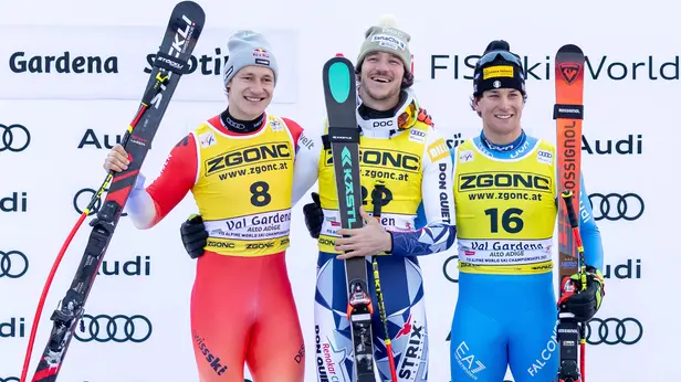 Second placed Marco Odermatt (L) of Switzerland, winner Jan Zabystan (C) of Czech Republic and third placed Giovanni Franzoni (R) of Italy celebrate on the podium after the Men's SuperG race at the FIS Alpine Skiing World Cup in Val Gardena, Italy, 19 December 2025. ANSA/LUCIANO SOLERO