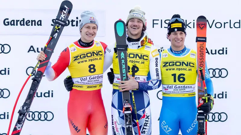 Second placed Marco Odermatt (L) of Switzerland, winner Jan Zabystan (C) of Czech Republic and third placed Giovanni Franzoni (R) of Italy celebrate on the podium after the Men's SuperG race at the FIS Alpine Skiing World Cup in Val Gardena, Italy, 19 December 2025. ANSA/LUCIANO SOLERO