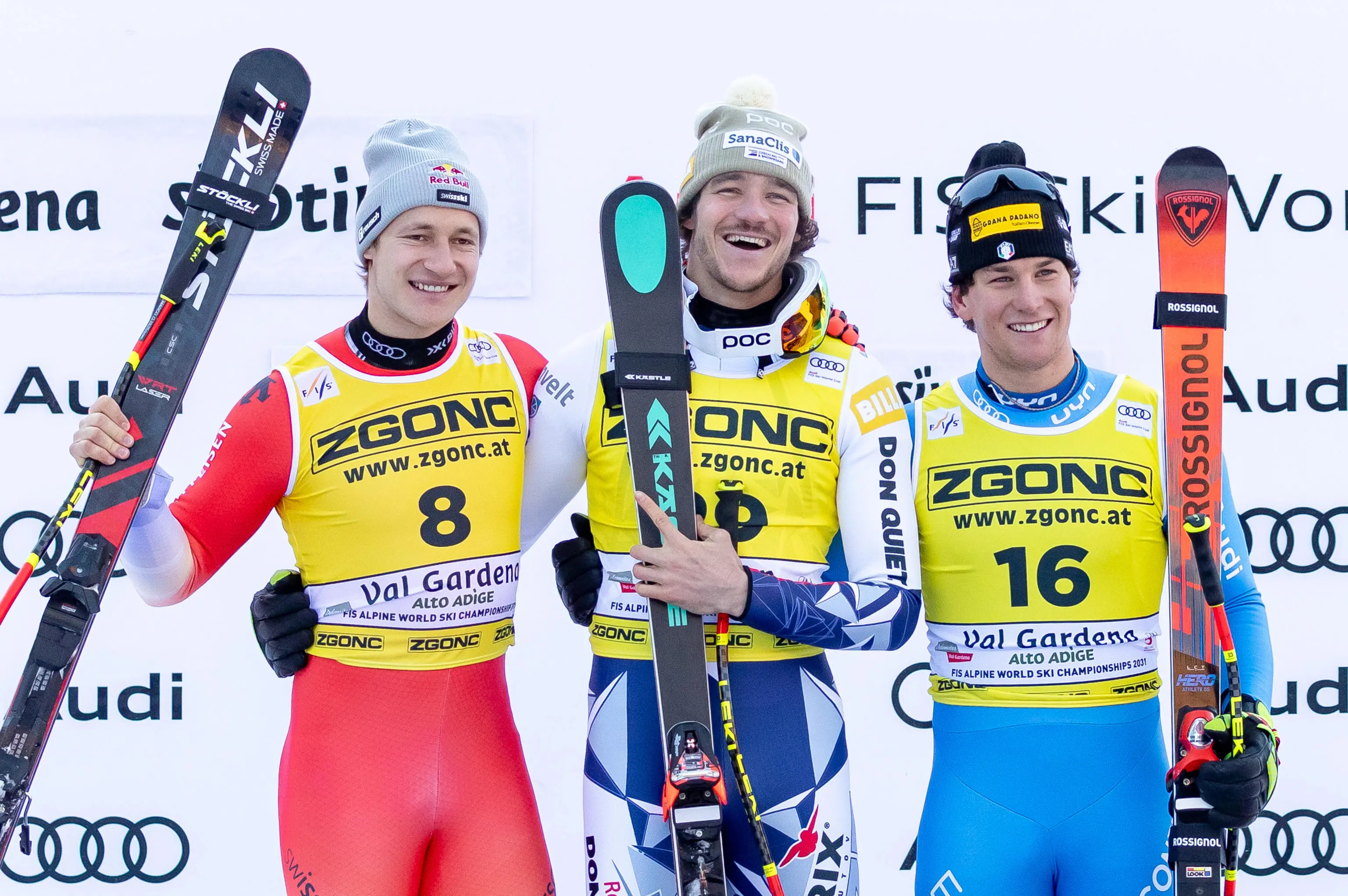 Second placed Marco Odermatt (L) of Switzerland, winner Jan Zabystan (C) of Czech Republic and third placed Giovanni Franzoni (R) of Italy celebrate on the podium after the Men's SuperG race at the FIS Alpine Skiing World Cup in Val Gardena, Italy, 19 December 2025. ANSA/LUCIANO SOLERO
