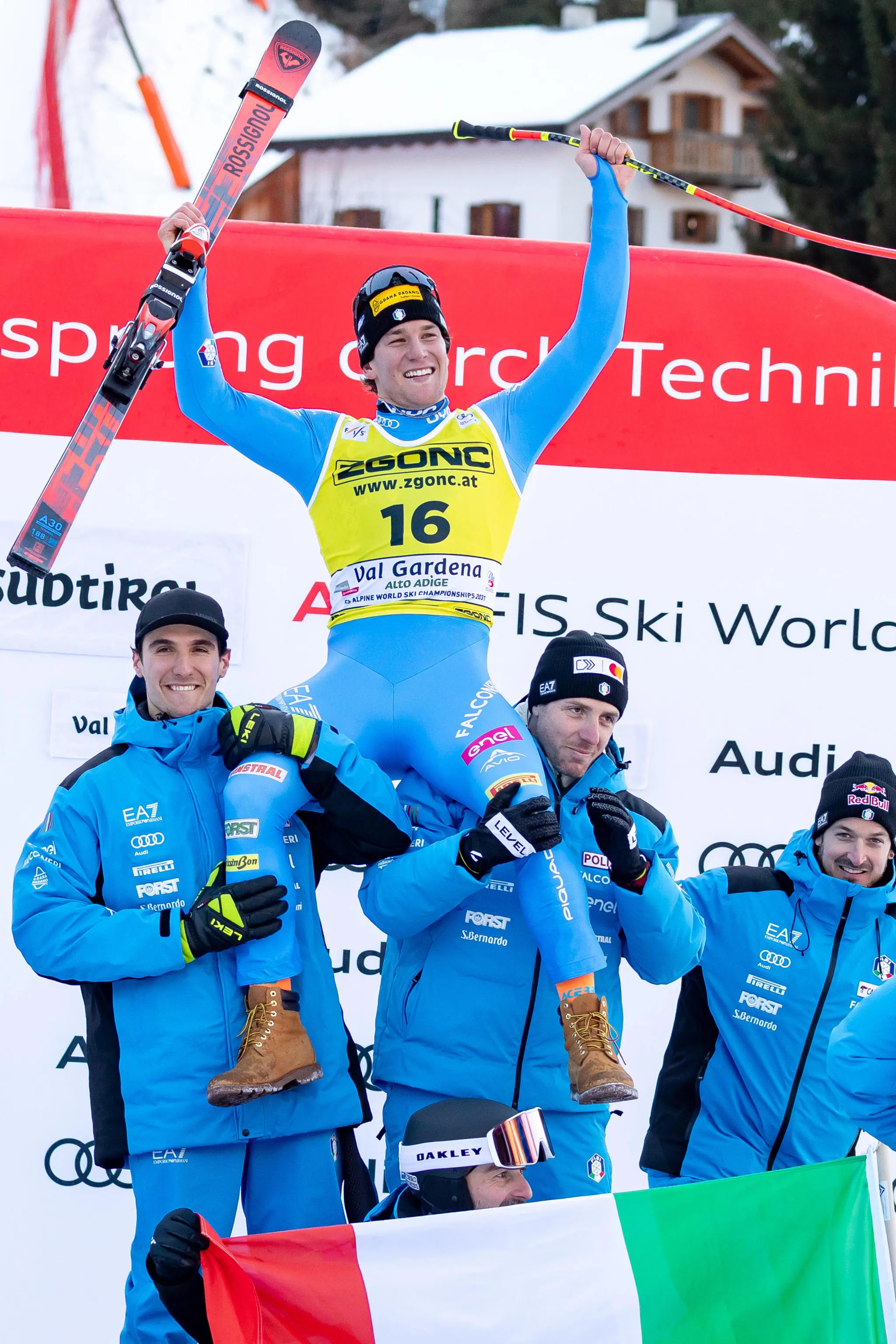 Third placed Giovanni Franzoni (C) of Italy celebrates on the podium after the Men's SuperG race at the FIS Alpine Skiing World Cup in Val Gardena, Italy, 19 December 2025. ANSA/LUCIANO SOLERO