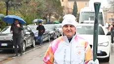 L'Uomo Gatto con la torcia olimpica