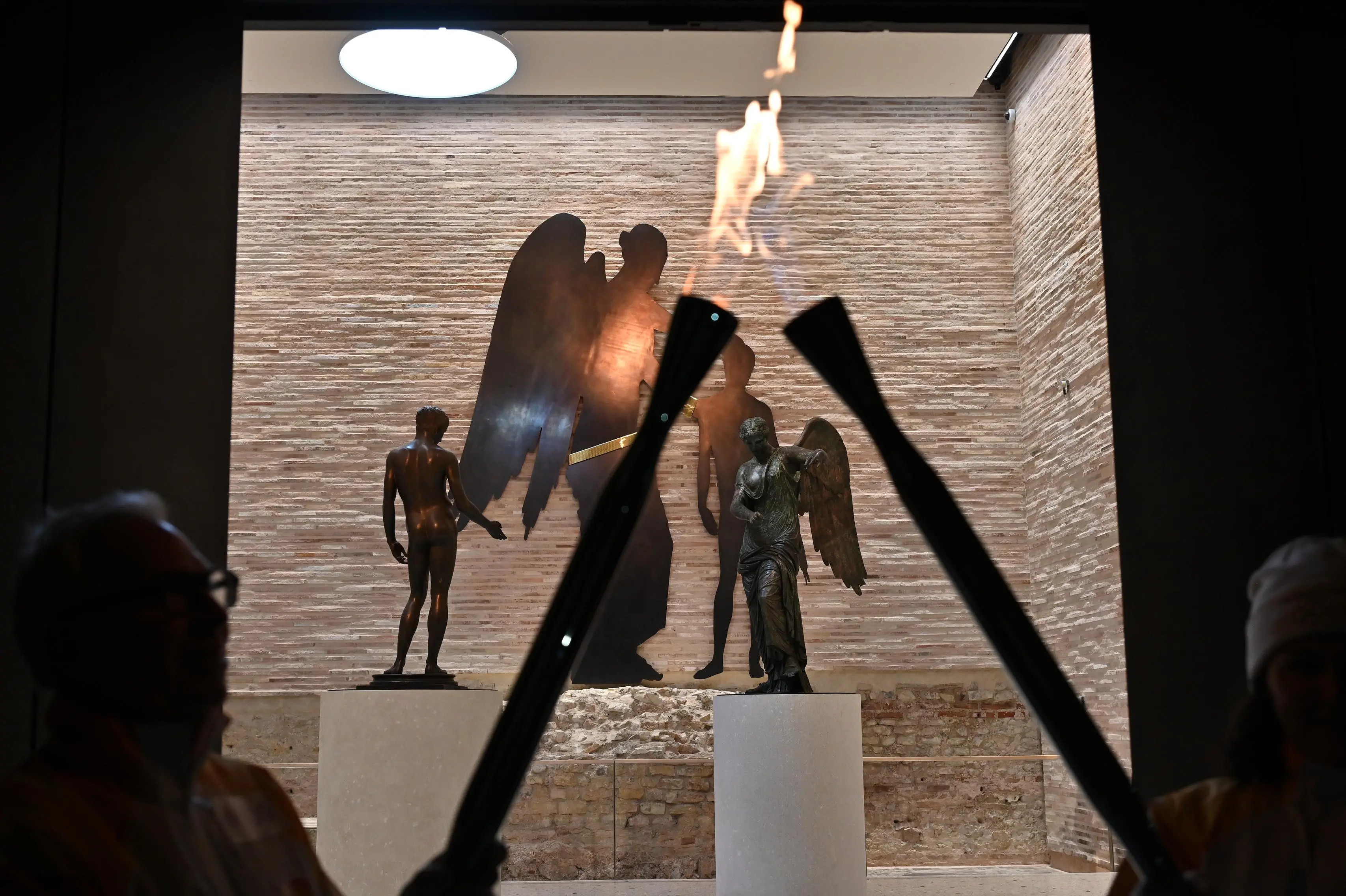 I tedofori con la Fiamma olimpica a Brescia