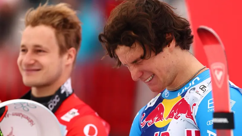 epa12677274 First placed Giovanni Franzoni of Italy celebrates on the podium after the Men's Downhill race at the FIS Alpine Skiing World Cup in Kitzbuehel, Austria, 24 January 2026.  EPA/ANNA SZILAGYI