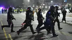 Agenti federali - Foto Ansa © www.giornaledibrescia.it