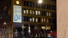 Proiezione dedicata ai Giochi sulla facciata della sede di A2A, a Milano