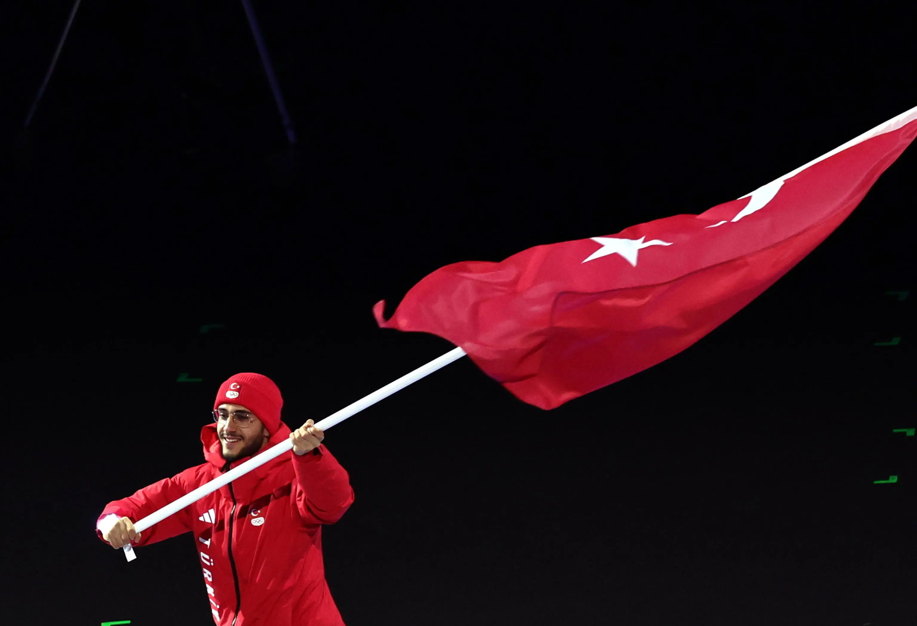 epa12710620 Flagbearer Furkan Akar leads the delegation of Turkey during the Opening Ceremony of the Milano Cortina 2026 Winter Olympic Games, in Milan, Italy, 06 February 2026. EPA/TERESA SUAREZ