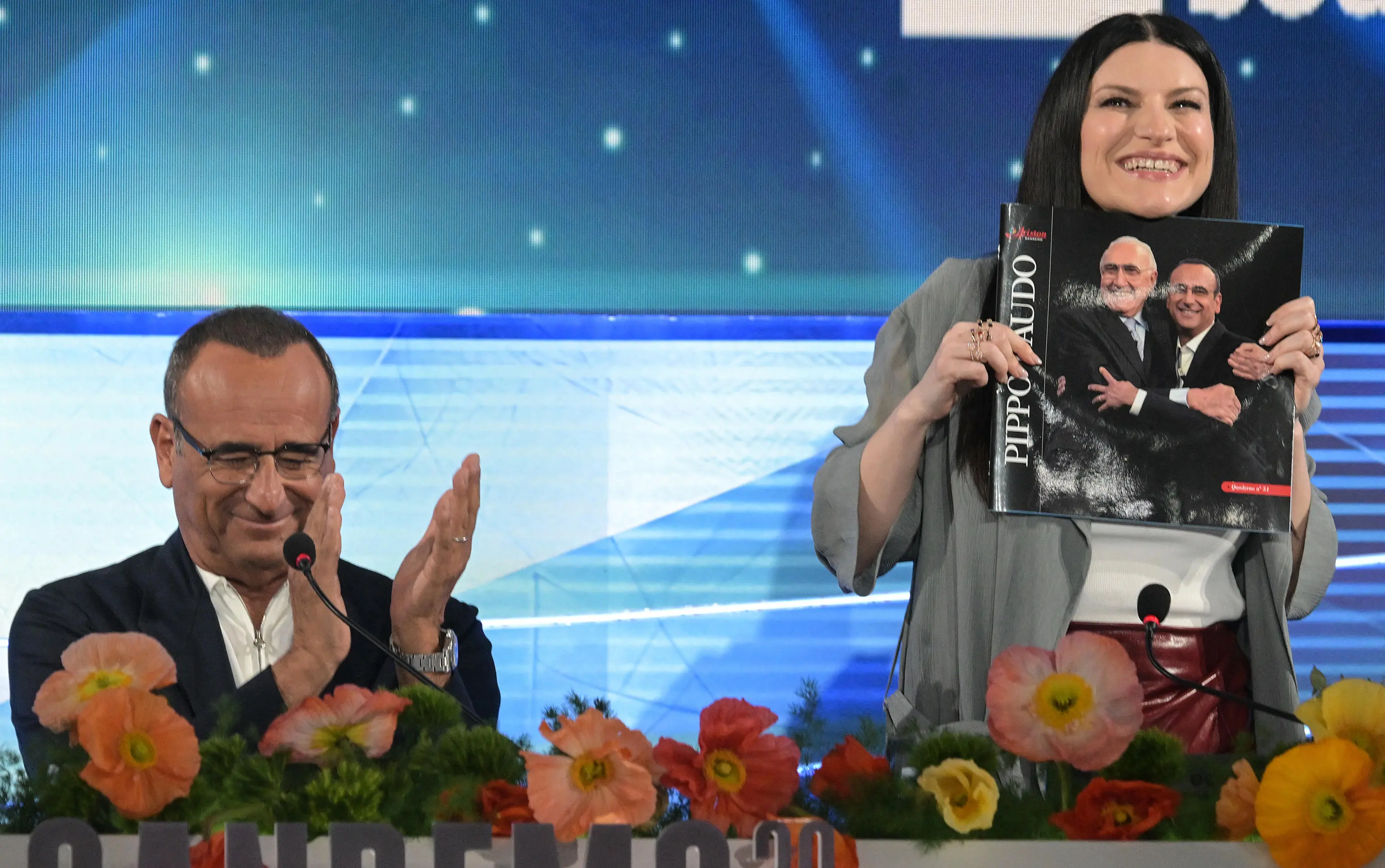 Sanremo Festival host and artistic director Carlo Conti (L) and Italian singer Laura Pausini (R) attend a press conference at the 76th Sanremo Italian Song Festival, Sanremo, Italy, 23 February 2026. The Music Festival runs from 24 to 28 February 2026. ANSA/RICCARDO ANTIMIANI