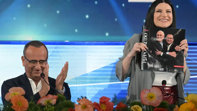 Sanremo Festival host and artistic director Carlo Conti (L) and Italian singer Laura Pausini (R) attend a press conference at the 76th Sanremo Italian Song Festival, Sanremo, Italy, 23 February 2026. The Music Festival runs from 24 to 28 February 2026. ANSA/RICCARDO ANTIMIANI