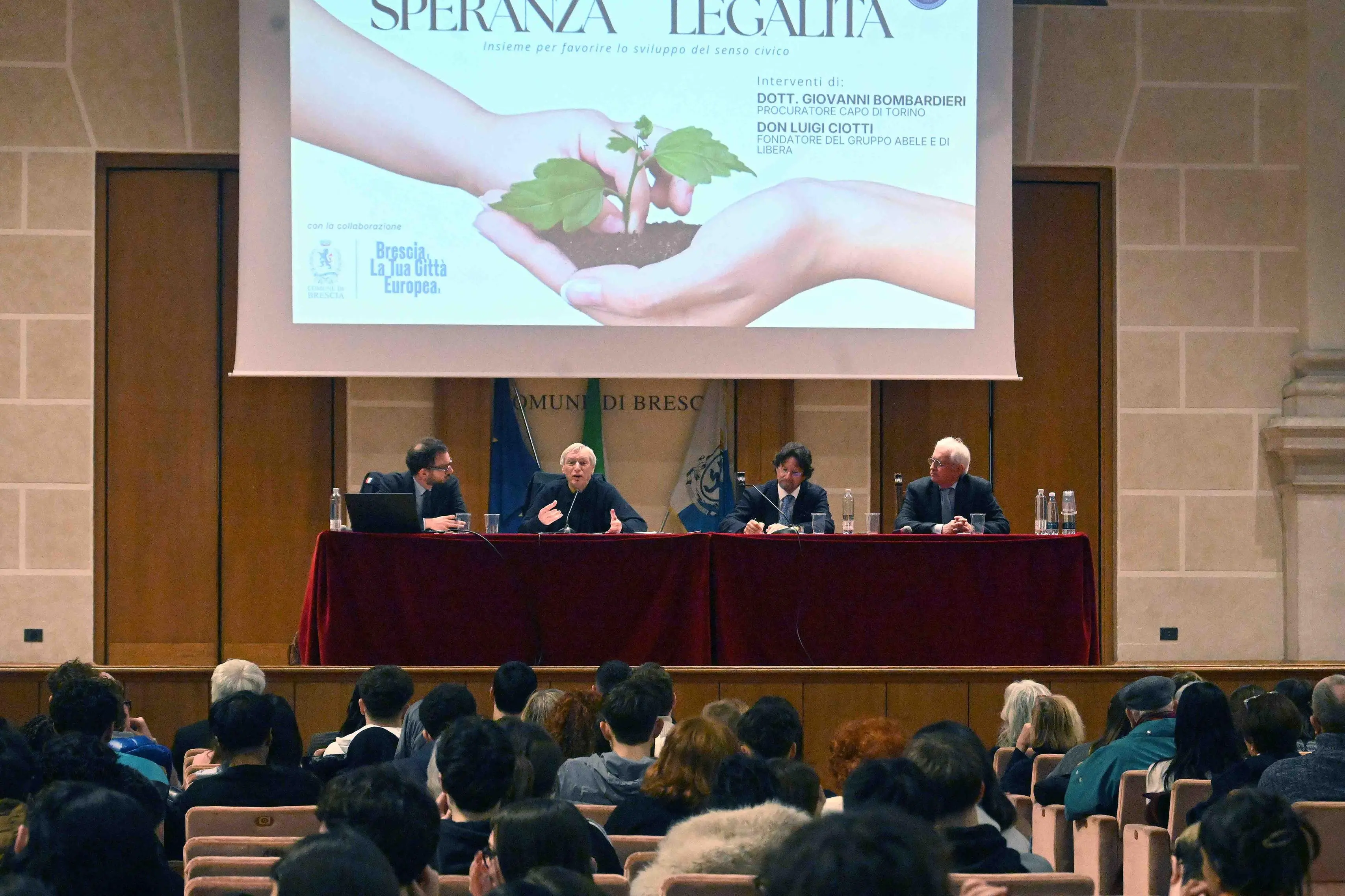 CRONACA BRESCIA AUDITORIUM SAN BARNABA SPERANZA E LEGALITA' NELLA FOTO DA SX CITTADINI CIOTTI BOMBARDIERI CAPELLO PER CARINI 23-02-2026 MARCO ORTOGNI NEW EDEN GROUP