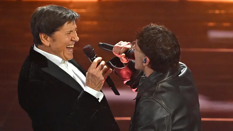 Italian singers Tredici Pietro (R) and Gianni Morandi perform on stage at the Ariston theatre during the 76th edition of the Sanremo Italian Song Festival, in Sanremo, Italy, 27 February 2026. The music festival will run from 24 to 28 February 2026. ANSA/RICCARDO ANTIMIANI