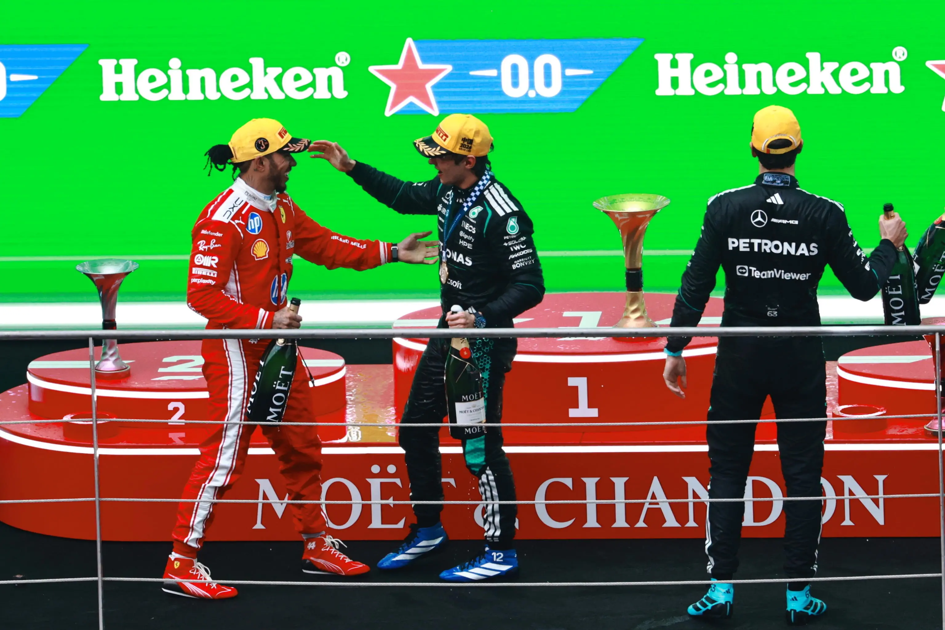 epa12820903 Winner Mercedes driver Andrea Kimi Antonelli (C) of Italy, second placed Mercedes driver George Russell (R) of Britain and third placed Scuderia Ferrari driver Lewis Hamilton of Britain celebrate after the 2026 Formula 1 Chinese Grand Prix, in Shanghai, China, 15 March 2026. EPA/ALEX PLAVEVSKI
