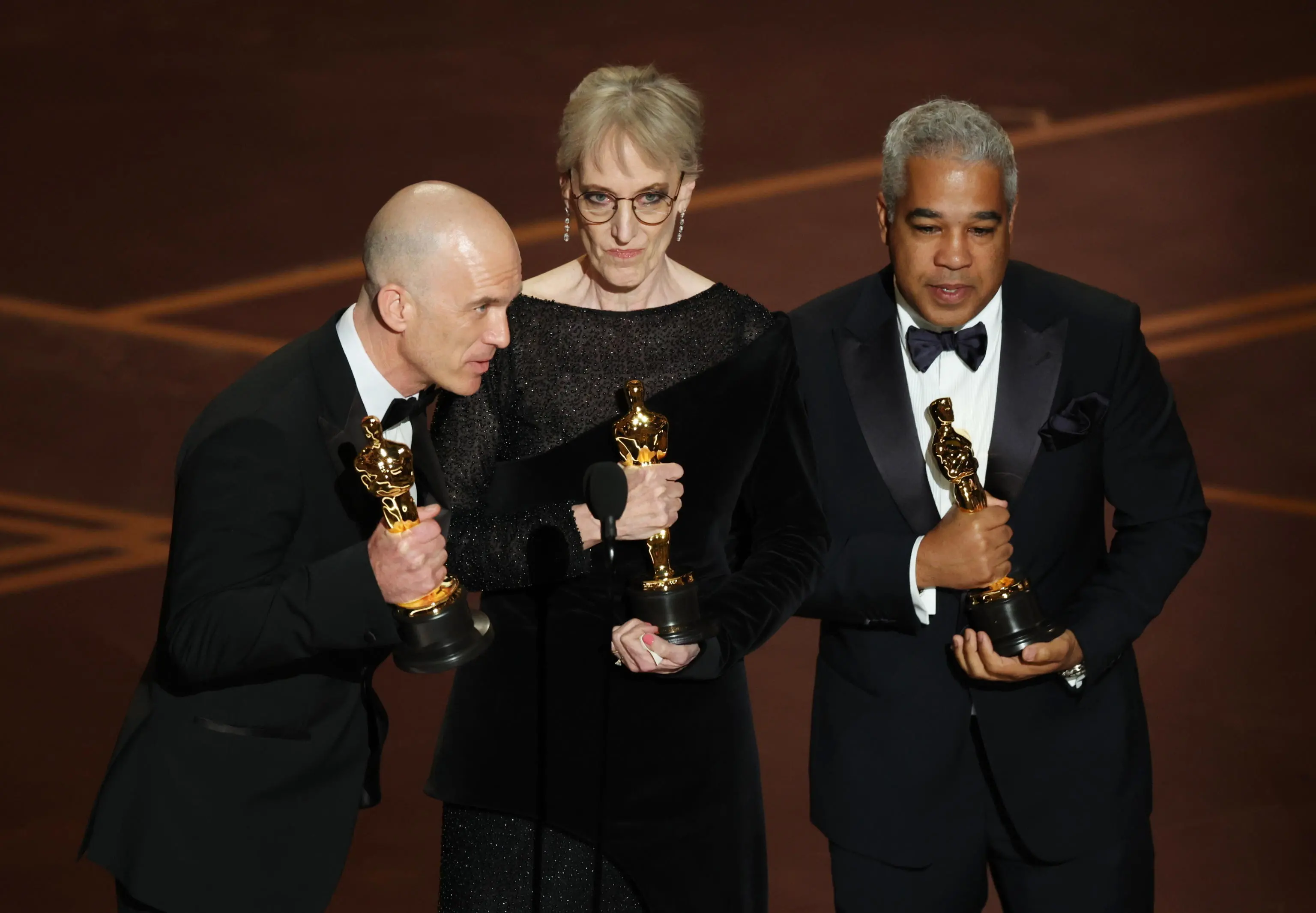epa12824530 (L-R) Gareth John, Gwendolyn Yates Whittle and Juan Peralta on stage after winning the Oscar for Best Sound for “F1” during the 98th annual Academy Awards ceremony at the Dolby Theatre in Los Angeles, California, USA, 15 March 2026. EPA/CHRIS TORRES