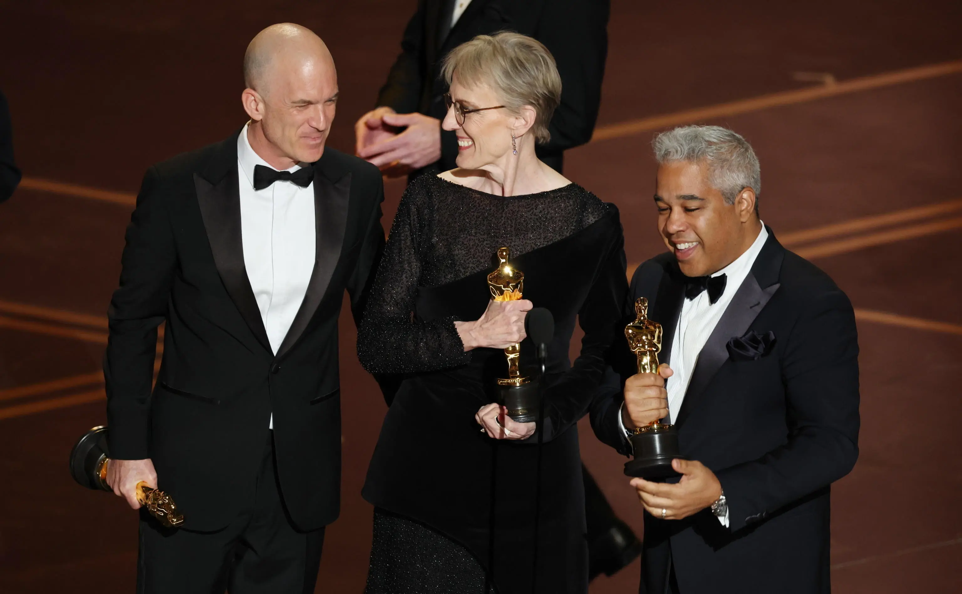 epa12824531 (L-R) Gareth John, Gwendolyn Yates Whittle and Juan Peralta on stage after winning the Oscar for Best Sound for “F1” during the 98th annual Academy Awards ceremony at the Dolby Theatre in Los Angeles, California, USA, 15 March 2026. EPA/CHRIS TORRES