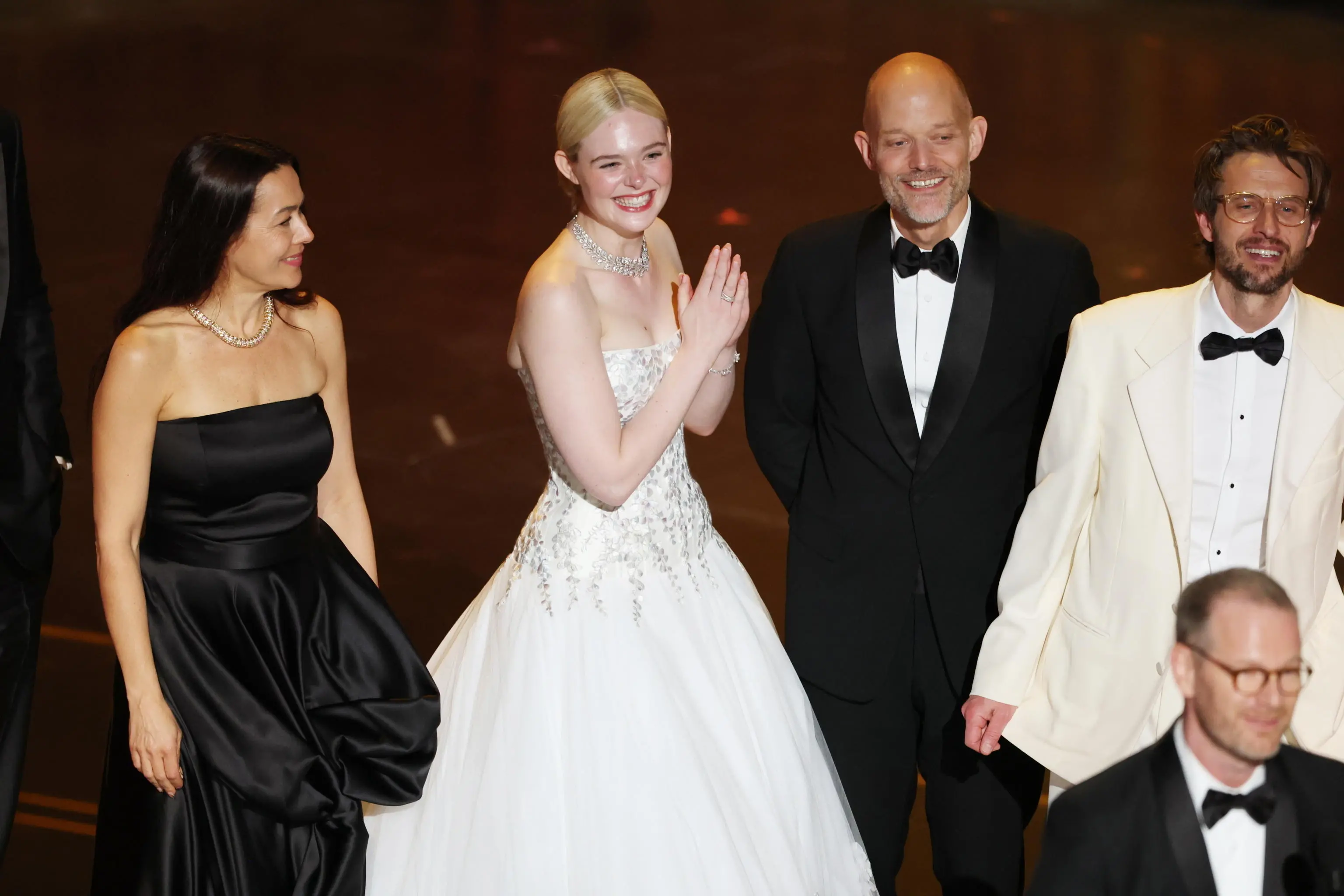 epa12824549 Elle Fanning (2-L) reacts while being on stage with the crew after Joachim Trier (bottom R) wins the Oscar for Best International Feature Film for "Sentimental Value" during the 98th annual Academy Awards ceremony at the Dolby Theatre in Los Angeles, California, USA, 15 March 2026. EPA/CHRIS TORRES