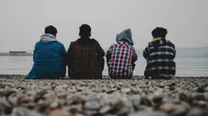 Quattro ragazzi in spiaggia