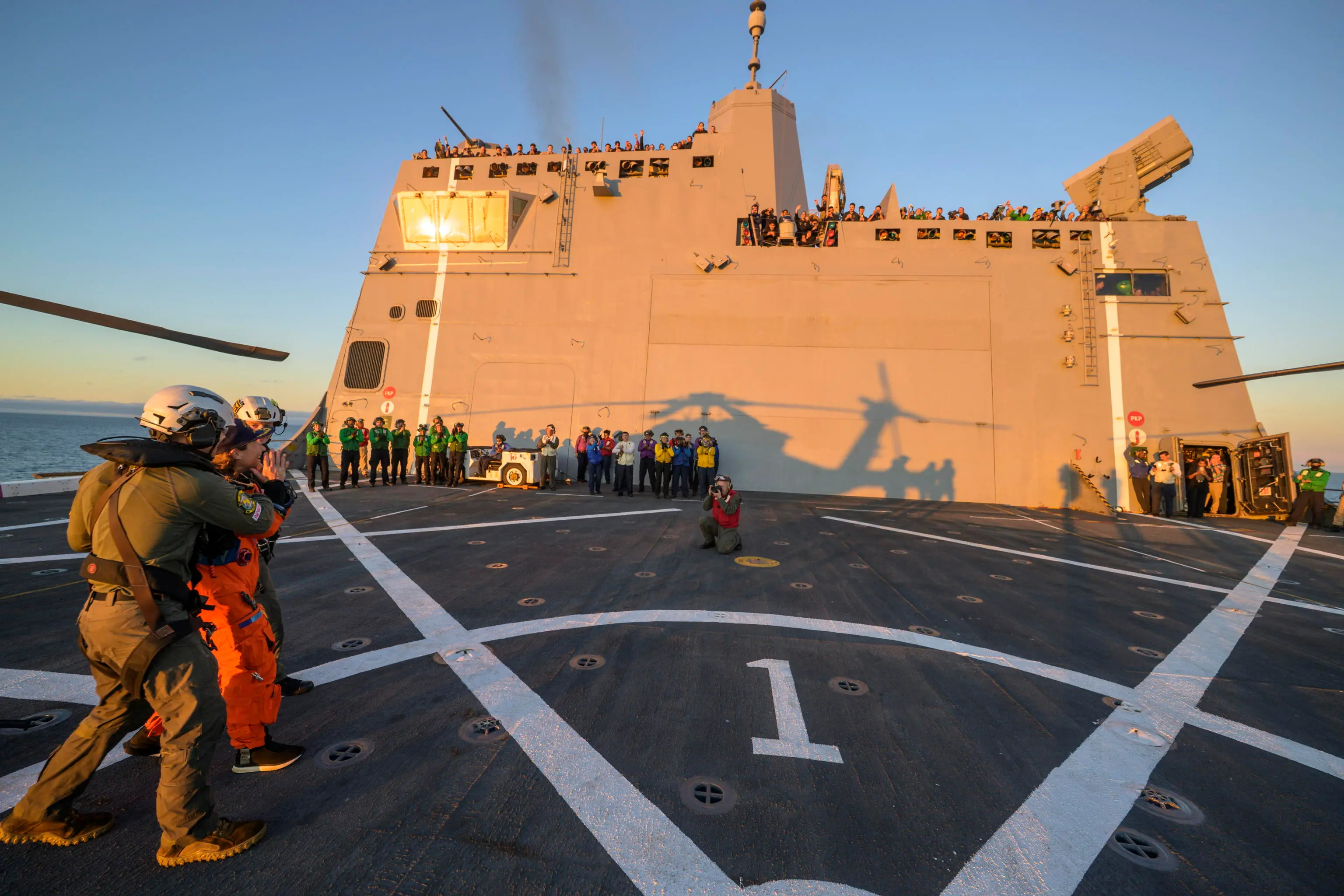 epa12882007 A handout photo made available by the National Aeronautics and Space Administration (NASA) shows a general view of NASA astronaut Christina Koch, Artemis II mission specialist being assisted off the flight deck after arriving aboard USS John P. Murtha after she and fellow crewmates NASA astronauts Reid Wiseman, commander; Victor Glover, pilot; and CSA (Canadian Space Agency) astronaut Jeremy Hansen, mission specialist were extracted from their Orion spacecraft after splashdown, in the Pacific Ocean off the coast of California, 10 April 2026. NASA’s Artemis II mission took the quartet on a nearly 10-day journey around the Moon and back to Earth. Following a splashdown at 5:07 p.m. PDT (8:07 p.m. EDT), NASA, U.S. Navy, and U.S. Air Force teams worked to bring the Orion spacecraft aboard the recovery ship. EPA/BILL INGALLS / NASA / HANDOUT HANDOUT EDITORIAL USE ONLY/NO SALES