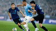 Lazio's Adam Marusic (L) and Inter’s Alessandro Bastoni (R) in action during during the Italian Cup final soccer match between SS Lazio and FC Inter at Olimpico stadium in Rome, Italy, 13 May 2026. ANSA/ANGELO CARCONI