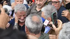 Gianni Alemanno appena uscito dal carcere - Foto Ansa © www.giornaledibrescia.it