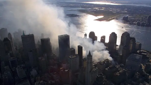 epa13210548 (FILE) - Smoke continues to rise from the destroyed World Trade Center in New York, USA, 15 September 2001 (reissued on 04 September 2026). On 11 September 2001, during a series of coordinated terror attacks using hijacked airplanes, two airplanes were flown into the World Trade Center's twin towers, causing the collapse of both towers. A third plane targeted the Pentagon, and a fourth plane heading towards Washington, DC ultimately crashed into a field. The 09/11 attacks were the deadliest terrorist attacks to occur on U.S. soil. In the days that followed, thousands of construction workers, firefighters, police officers, and volunteers flocked to the World Trade Center site to search for survivors and begin recovery efforts. Air travel came to a standstill, and people posted missing-person flyers all over the city as they moved through the dust and ash floating over Lower Manhattan EPA/KEITH MEYERS / POOL / POOL