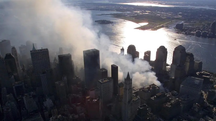 epa13210548 (FILE) - Smoke continues to rise from the destroyed World Trade Center in New York, USA, 15 September 2001 (reissued on 04 September 2026). On 11 September 2001, during a series of coordinated terror attacks using hijacked airplanes, two airplanes were flown into the World Trade Center's twin towers, causing the collapse of both towers. A third plane targeted the Pentagon, and a fourth plane heading towards Washington, DC ultimately crashed into a field. The 09/11 attacks were the deadliest terrorist attacks to occur on U.S. soil. In the days that followed, thousands of construction workers, firefighters, police officers, and volunteers flocked to the World Trade Center site to search for survivors and begin recovery efforts. Air travel came to a standstill, and people posted missing-person flyers all over the city as they moved through the dust and ash floating over Lower Manhattan EPA/KEITH MEYERS / POOL / POOL